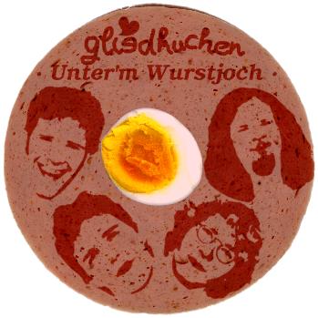 Eine Wurst mit den Gesichtern von Gliedkuchen, dem Bandnamen und dem Albumtitel, sowie einem Ei darin